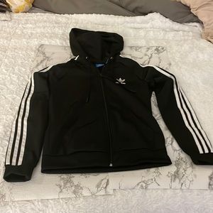 Adidas jacket - classic look with stripes down arms and a hood. Very gently worn